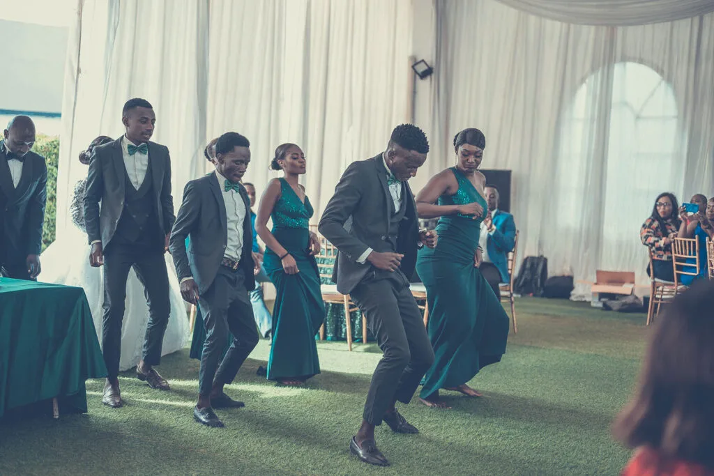 Wedding guests line dancing